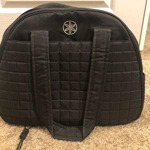 Black Gaiam gym bag with yoga mat holder